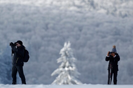 Hikers wear snow shoes as they make pictures on a cold and sunny winter's day in Paris. (Image for representation/REUTERS)