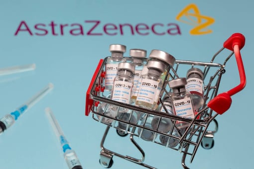 A small shopping basket filled with vials labeled 'COVID-19 - Coronavirus Vaccine' and medical sryinges are placed on an AstraZeneca logo in this illustration taken on November 29, 2020. (REUTERS/Dado Ruvic/Ilustration)