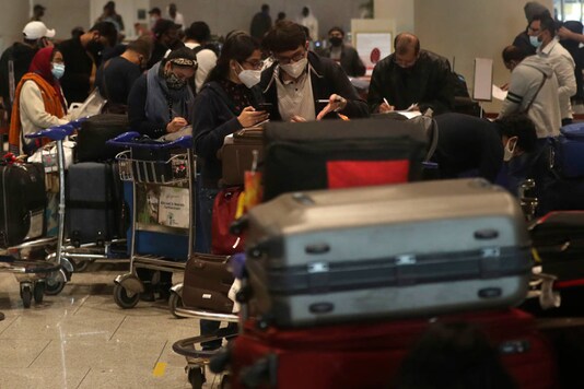 For Representation. Passengers arriving from United Kingdom fill in forms with their travel details at Chhatrapati Shivaji Maharaj International Airport in Mumbai, on December 22, 2020. (AP Photo/Rafiq Maqbool/Representative image)
