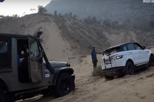 Evoque is pulled by attaching a winch to the back of the SUV with the help of Thar. (Credit: Youtube)