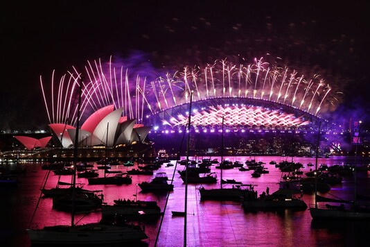 Fireworks explode over the Sydney Opera House and Sydney Harbour Bridge during downsized New Year's Eve celebrations due to an outbreak of the coronavirus disease in Sydney, Australia, January 1, 2021. (Image: Reuters)
