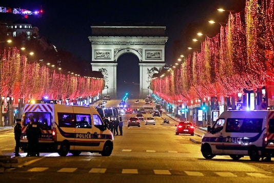French police patrol on the Champs Elysees avenue in Paris after celebrations and gatherings have been banned due to COVID-19 restrictions amid the coronavirus disease outbreak in France, December 31, 2020. REUTERS French police patrol on the Champs Elysees avenue in Paris after celebrations and gatherings have been banned due to COVID-19 restrictions amid the coronavirus disease outbreak in France, December 31, 2020. REUTERS