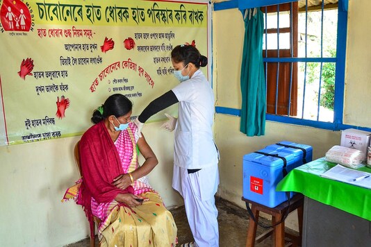 A medic demonstrates administration of COVAXIN to a health worker during its trials at Tezpur in Assam. (PTI)