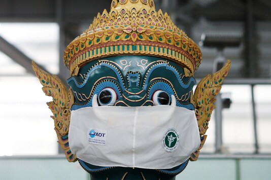 A Thai traditional giant statue wears a protective mask, amid the coronavirus disease (COVID-19) pandemic, at Suvarnabhumi Airport in Bangkok, Thailand December 15, 2020. REUTERS/Soe Zeya Tun/Files