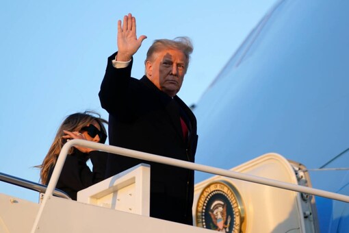 President Donald Trump waves as he boards Air Force One. (AP Photo/Patrick Semansky)