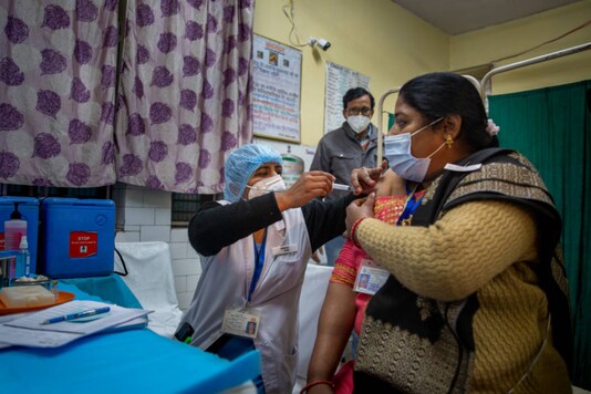A health worker engages in a Covid-19 vaccine delivery system trial in New Delhi on January 2, 2021. (AP Photo/Altaf Qadri)