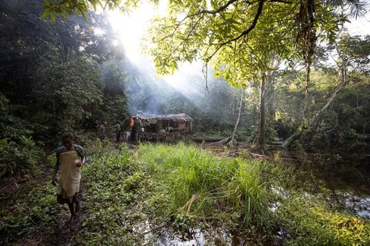 FILE PHOTO: Hunters stand in a camp in the forest an eight hour paddle from the city of Mbandaka in Democratic Republic of the Congo.

REUTERS/Thomas Nicolon