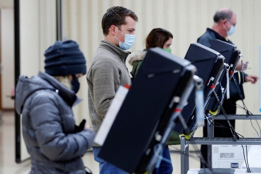 Voters cast their ballots in the U.S. Senate run-off election, at a polling station in Marietta, Georgia, U.S., January 5, 2021. REUTERS/Mike Segar
Voters cast their ballots in the U.S. Senate run-off election, at a polling station in Marietta, Georgia, U.S., January 5, 2021. REUTERS/Mike Segar