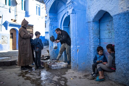 A fishermen sells his catch of the day in an alleyway in Chefchaouen, in northern Morocco. (AP Photo/Mosa'ab Elshamy)