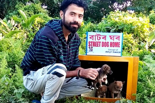Abhijit with his dog shelter made from old TV sets.