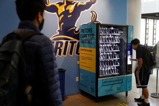 Covid 19 testing kits stocked in a vending machine.
(Credit: Reuters)