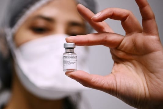 A healthcare worker holds up a covid Vaccine vial. (Image for representation/AFP)