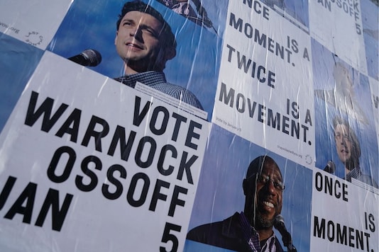 Campaign ads for Jon Ossoff and Raphael Warnock seen on a wall in Atlanta, Georgia. (Reuters) Campaign ads for Jon Ossoff and Raphael Warnock seen on a wall in Atlanta, Georgia. (Reuters)