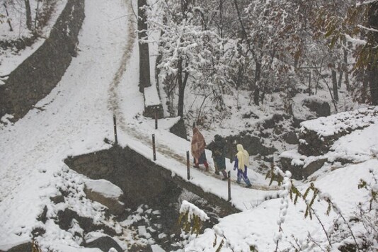 File photo of heavy rainfall in Jammu and Kashmir. (Image: AP)