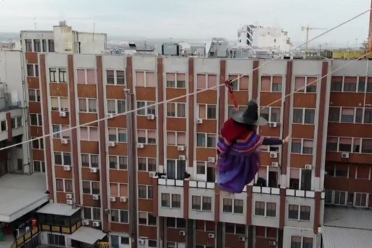 Video grab of the 'witch' cheering children at Italy's hospital.
(Credit: Twitter/ Reuters)