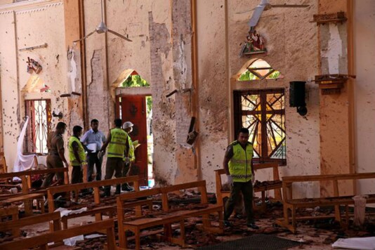 File photo of police officers work at the scene at St. Sebastian Catholic Church, after bomb blasts ripped through churches and luxury hotels on Easter, in Negombo, Sri Lanka on April 22, 2019. (Reuters)