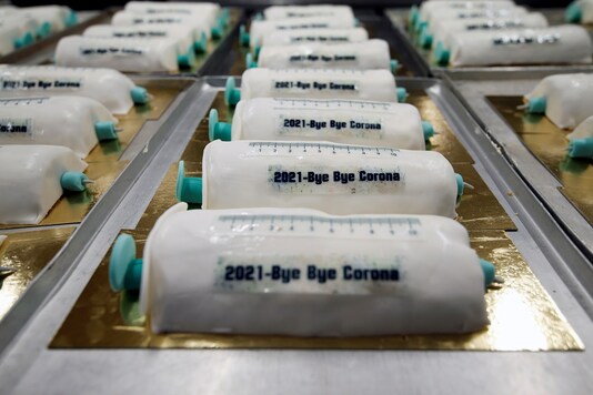 Cakes in the shape of syringes are seen at the Schuerener Backparadies bakery, as the vaccination rollout against the coronavirus disease (COVID-19) continues, in Dortmund, Germany, January 8, 2021. REUTERS/Leon Kuegeler