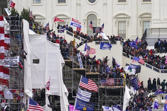 Trump supporters gather outside the Capitol, Wednesday, Jan. 6, 2021, in Washington. (AP Photo/John Minchillo) Trump supporters gather outside the Capitol, Wednesday, Jan. 6, 2021, in Washington. (AP Photo/John Minchillo)