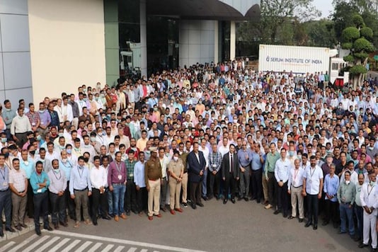 Serum Institute employees with CEO Adar Poonawalla in Pune on Tuesday. Serum Institute employees with CEO Adar Poonawalla in Pune on Tuesday.