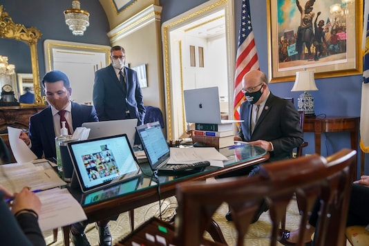House Rules Committee Chairman Jim McGovern, D-Mass, right, leads a partially-virtual hearing to consider a resolution calling on Vice President Mike Pence to activate the 25th Amendment to declare President Donald Trump incapable of executing the duties of his office, at the Capitol in Washington, Tuesday, Jan. 12, 2021. (AP Photo) House Rules Committee Chairman Jim McGovern, D-Mass, right, leads a partially-virtual hearing to consider a resolution calling on Vice President Mike Pence to activate the 25th Amendment to declare President Donald Trump incapable of executing the duties of his office, at the Capitol in Washington, Tuesday, Jan. 12, 2021. (AP Photo)