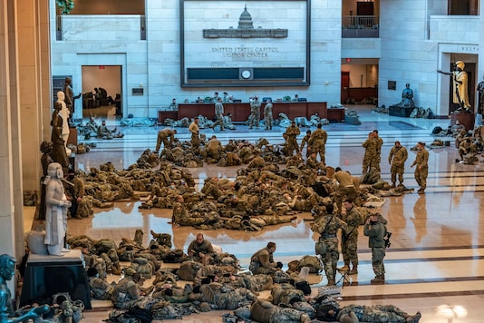 Hundreds of National Guard troops hold inside the Capitol Visitor's Center to reinforce security at the Capitol in Washington on Wednesday. (AP) Hundreds of National Guard troops hold inside the Capitol Visitor's Center to reinforce security at the Capitol in Washington on Wednesday. (AP)