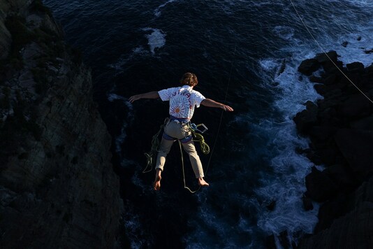 An adventure sport enthusiast leaps from a cliff edge over the ocean while rope jumping near Currarong, Australia.

REUTERS/Loren Elliott