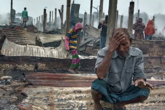 A Rohingya man reacts after a fire burned houses of the Nayapara refugee camp in Cox's Bazar, Bangladesh, January 14. (Image: Reuters)