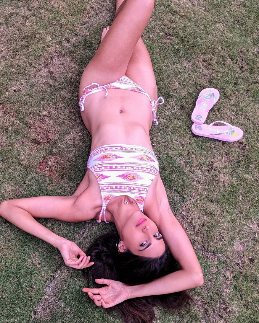  Lazing around on the park in a two-piece. (Image: Instagram)