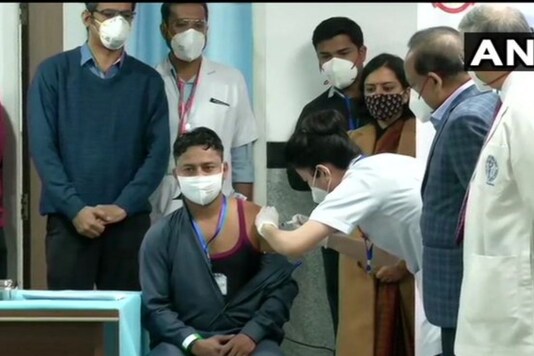 Sanitation worker Manish Kumar gets the coronavirus vaccine. (ANI)