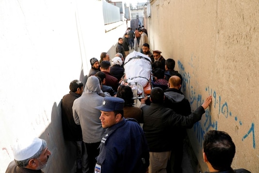 Relatives carry the body of one of the female judges shot dead by unknown gunmen in Kabul, Afghanistan January 17, 2021. REUTERS/Mohammad Ismail TPX IMAGES OF THE DAY Relatives carry the body of one of the female judges shot dead by unknown gunmen in Kabul, Afghanistan January 17, 2021. REUTERS/Mohammad Ismail TPX IMAGES OF THE DAY