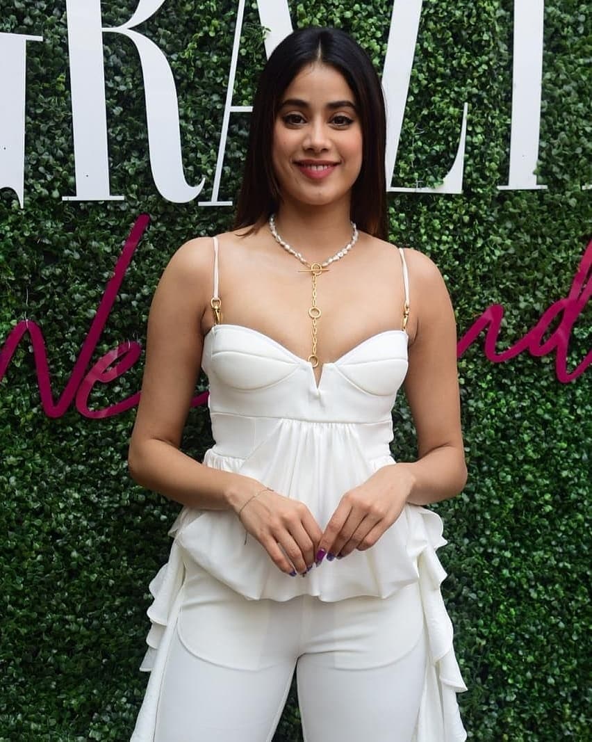  In a white jumpsuit while attending an event. (Image: Instagram)