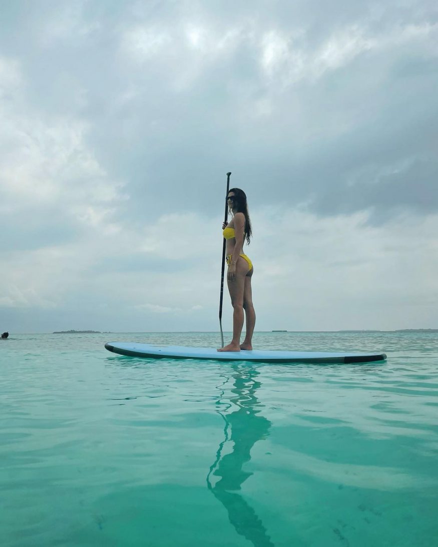  Seen canoeing in a yellow bikini. (Image: Instagram)