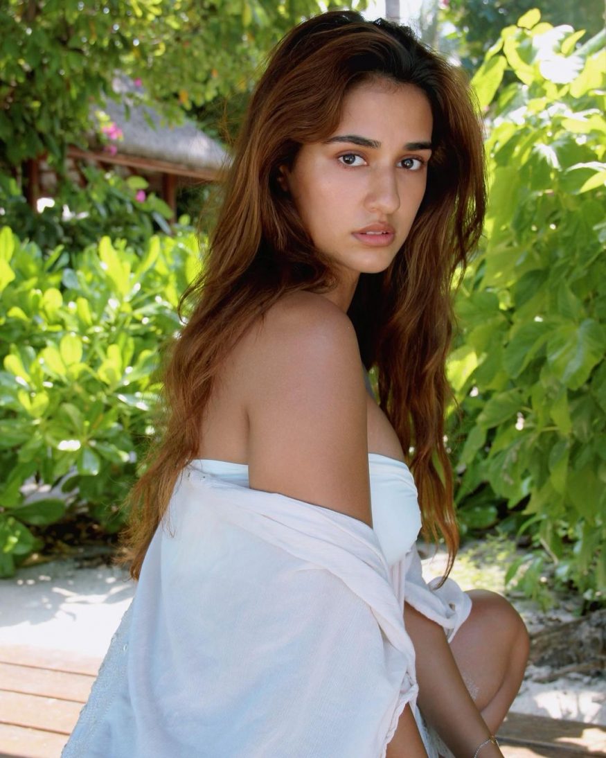 She strikes a seductive pose in a white bikini. (Image: Instagram) She strikes a seductive pose in a white bikini. (Image: Instagram)