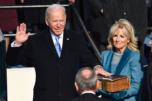 Joe Biden is sworn in as the 46th president of the United States by Chief Justice John Roberts as Jill Biden holds the Bible during the 59th Presidential Inauguration at the U.S. Capitol in Washington, Wednesday. (AP)