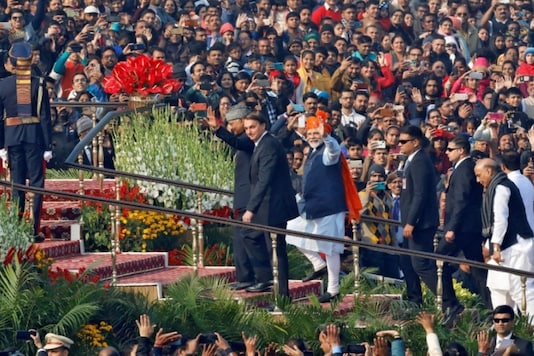 Prime Minister Narendra Modi waves next to Brazil's President Jair Bolsonaro and India's President Ram Nath Kovind as they arrive to attend India's Republic Day parade in New Delhi, India., in 2020.(Image: Reuters) 