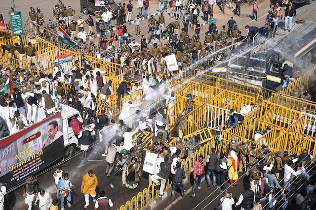 Bhopal Police use water cannons on Congress workers during their protest against the new farm laws, in Bhopal. (Image: PTI)