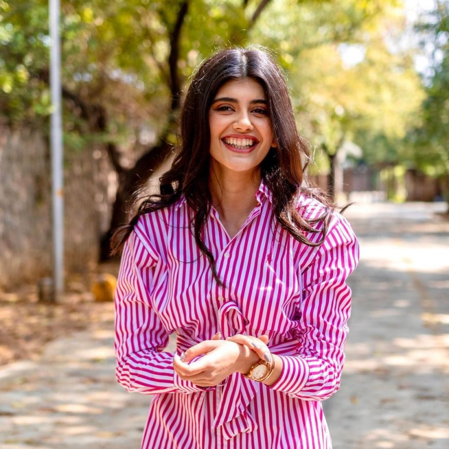  Sanjana lights up in this pink and white striped outfit. (Image: Instagram)