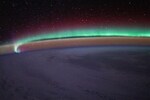The space station's orbit takes it as high 51.6 degrees above the equator offering awe-inspiring views of the Earth's aurora in between the city lights and the twinkling stars. (Caption by ISS)