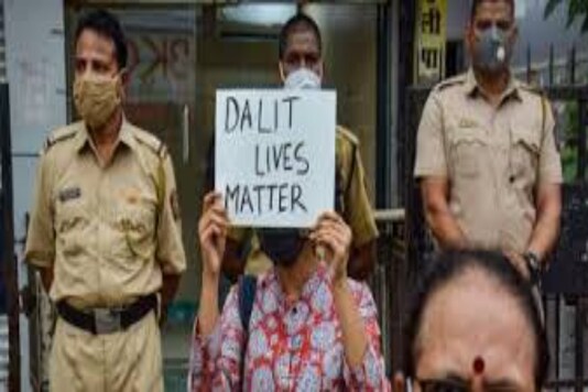 Photo of Man Holding Placard Of Dalit Lives Matter 