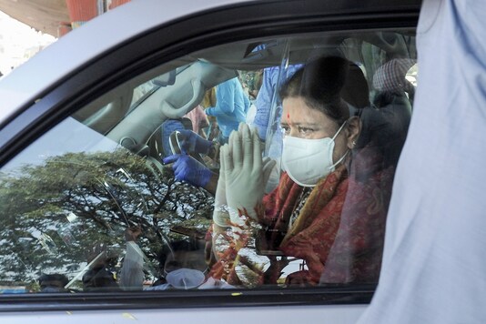 Expelled AIADMK leader VK Sasikala greets her supporters after she got discharged from a hospital, in Bengaluru, Sunday, Jan. 31, 2021. (PTI Photo)