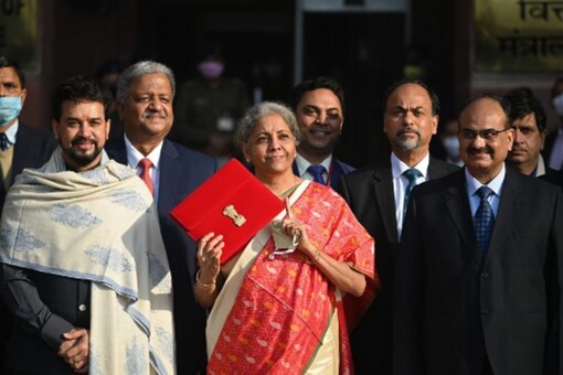 Finance Minister Nirmala Sitharaman and her staff leave the Finance Ministry to present the annual budget in parliament in New Delhi on February 1. (AFP)