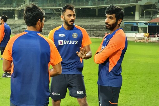 Axar Patel and Jasprit Bumrah talk in practice. 