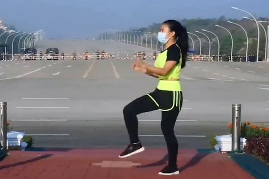 Khing Hnin Wai shoots a video of herself doing aerobics in Myanmar’s capital. Khing Hnin Wai shoots a video of herself doing aerobics in Myanmar’s capital.