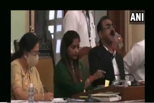 A senior official of the BMC erroneously drank sanitiser instead of water while presenting the civic body's education budget in Mumbai on Wednesday. (Image: ANI)