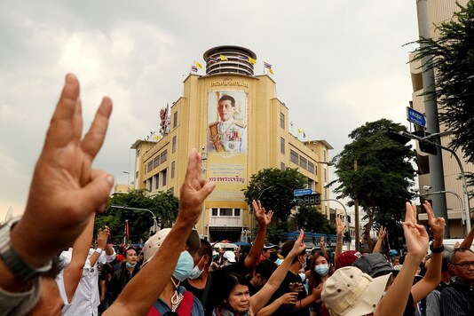 File photo:  A portrait of King Maha Vajiralongkorn is seen as pro-democracy demonstrators give a three-finger salute while marching during a Thai anti-government mass protest, on the 47th anniversary of the 1973 student uprising, in Bangkok, Thailand.

REUTERS/Jorge Silva/File Photo