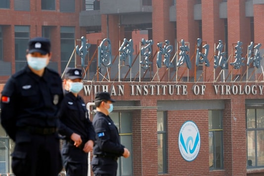 Security personnel keep watch outside the Wuhan Institute of Virology during the visit by the World Health Organization (WHO) team tasked with investigating the origins of the coronavirus disease (COVID-19), in Wuhan, Hubei province, China February 3, 2021. REUTERS/Thomas Peter
