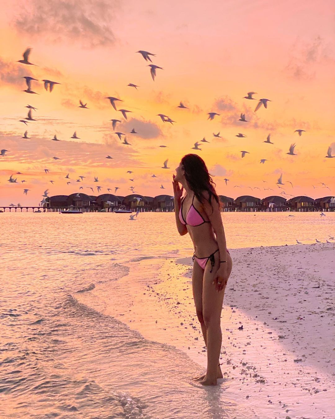 Sakshi marvels at the sunset dressed in a pink two-piece. (Image: Instagram)