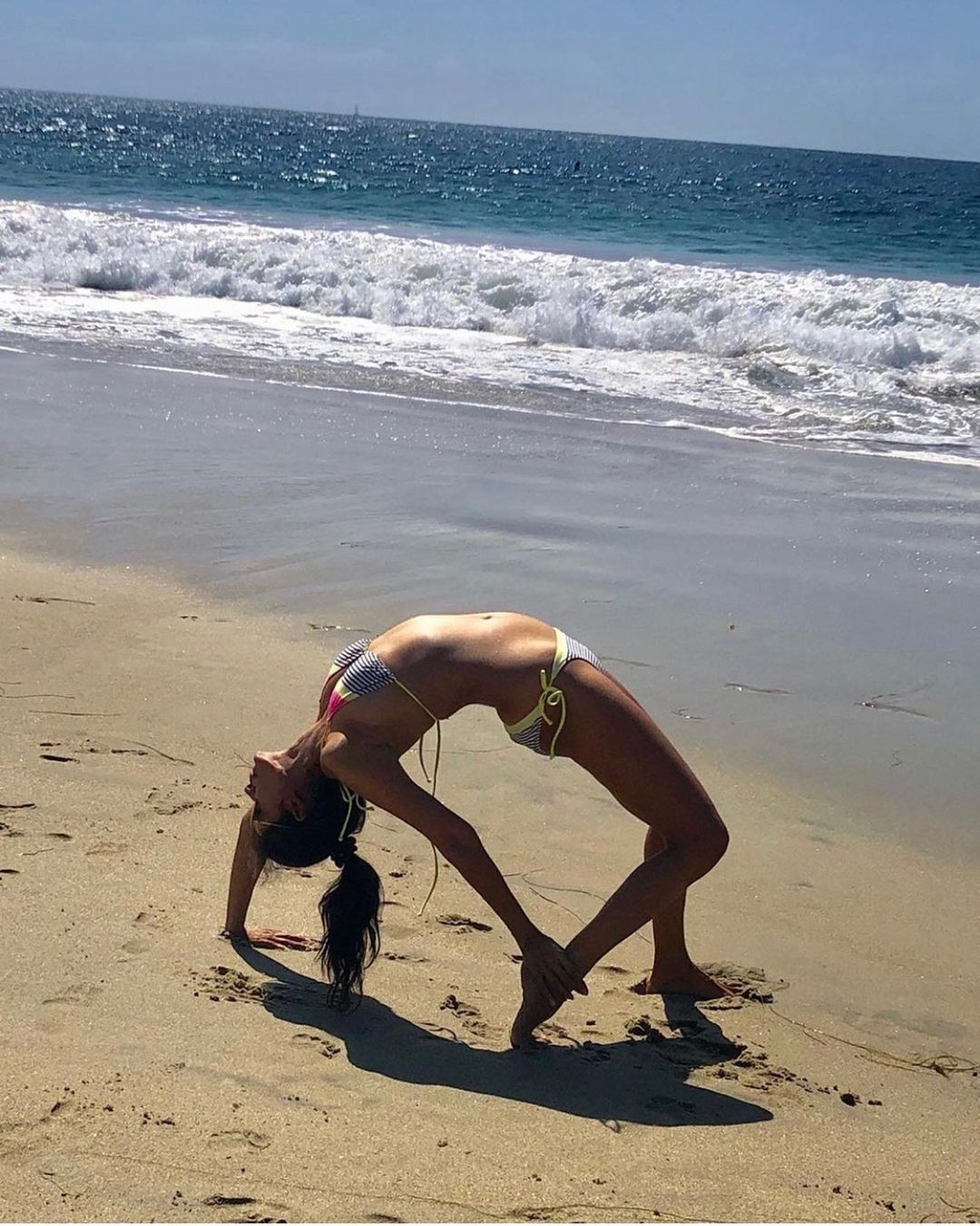  Vidya practices a posture on the beach. (Image: Instagram)