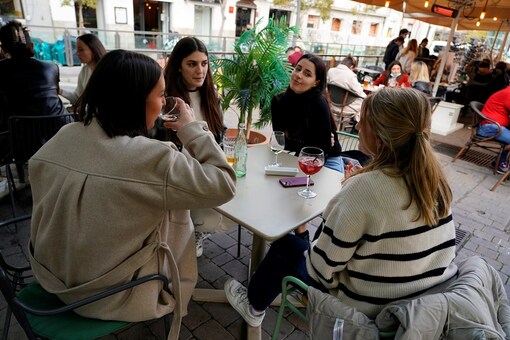 French women enjoy a meal on a terrace for their holiday week during the COVID-19 pandemic in Madrid, Spain. 

(Credit: REUTERS/Juan Medina)