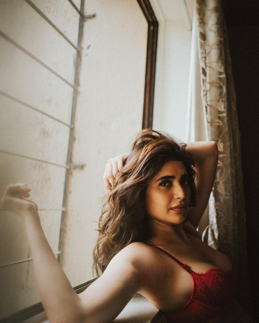  She also shared this sensuous photo in a red bra, perfect for the Valentine month. (Image: Instagram)